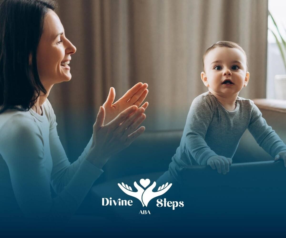 A BCBA clapping and encouraging a toddler with autism standing on a couch.