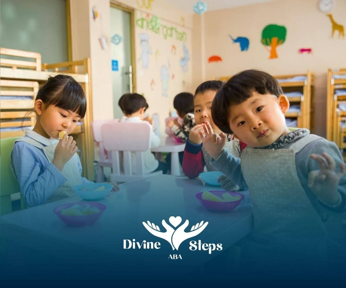 Autistic kids sitting at a table eating snacks in a classroom after their ABA therapy in Maryland.