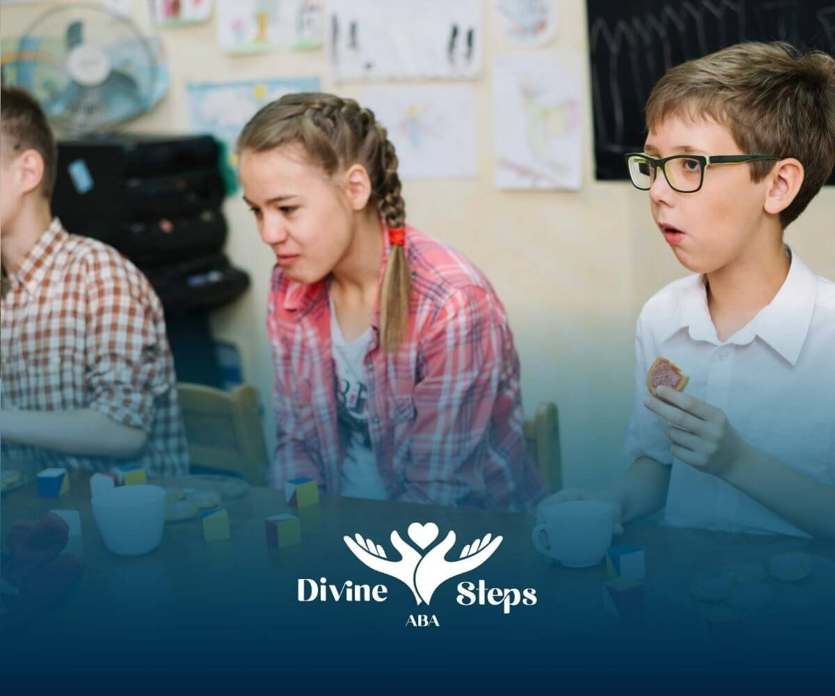 Three autistic kids at a table with snacks & colorful blocks, showing varied reactions in group play