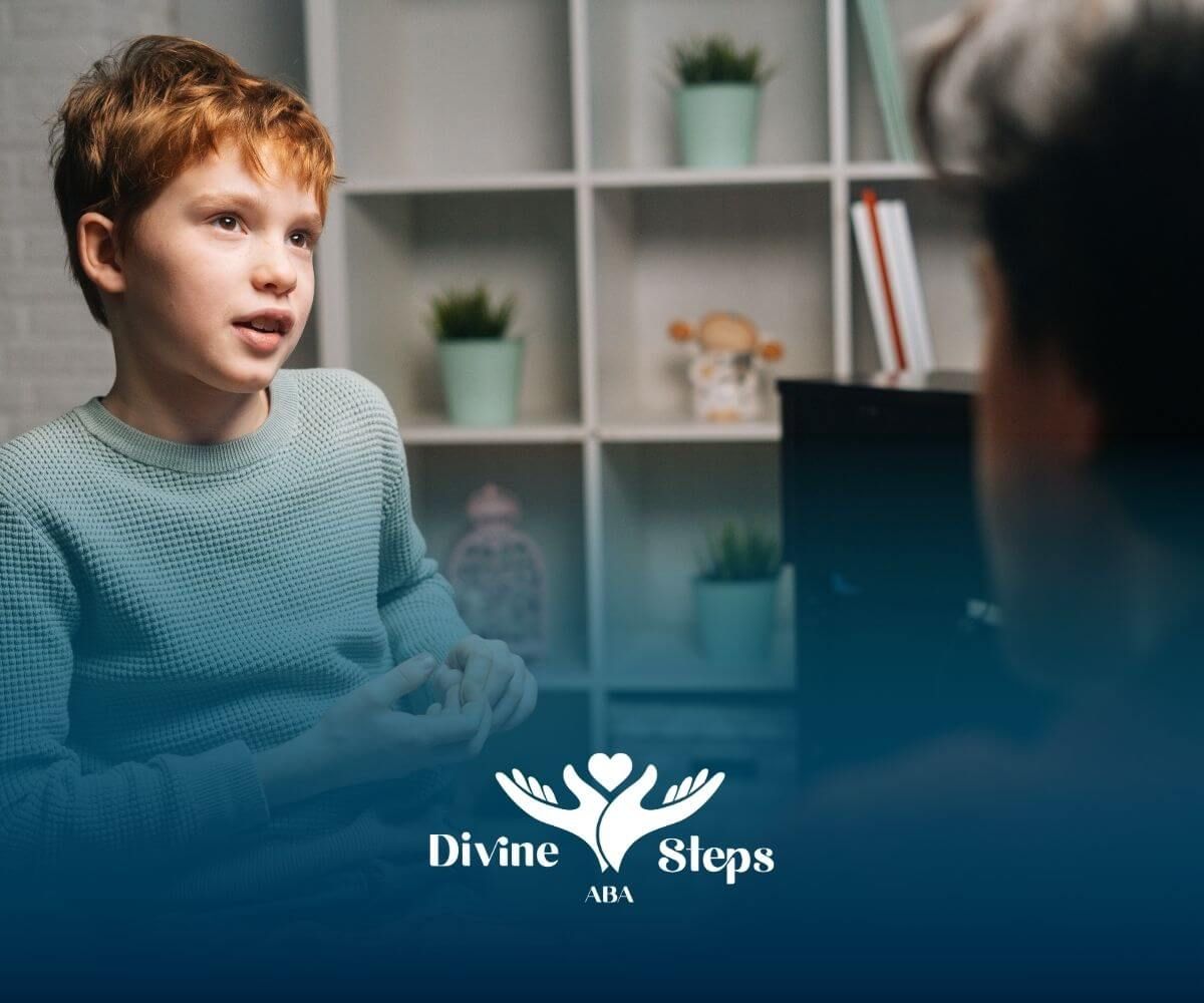 Autistic boy practices conversation in one-on-one therapy with therapist support in calm setting.
