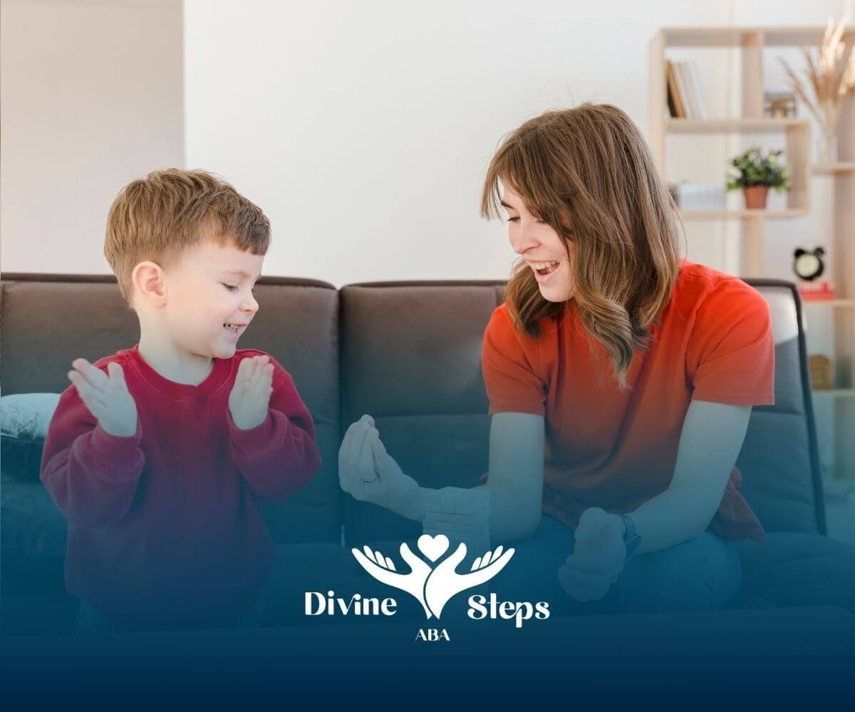 Therapist and autistic child celebrate stacking block game success during focused ABA session.