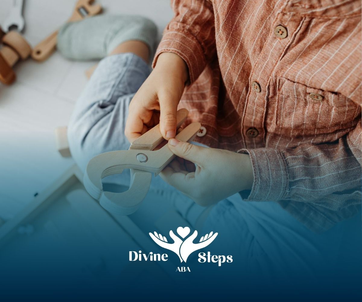 Autistic child sitting cross-legged assembling a toy tool with clamp during ABA therapy in Virginia.