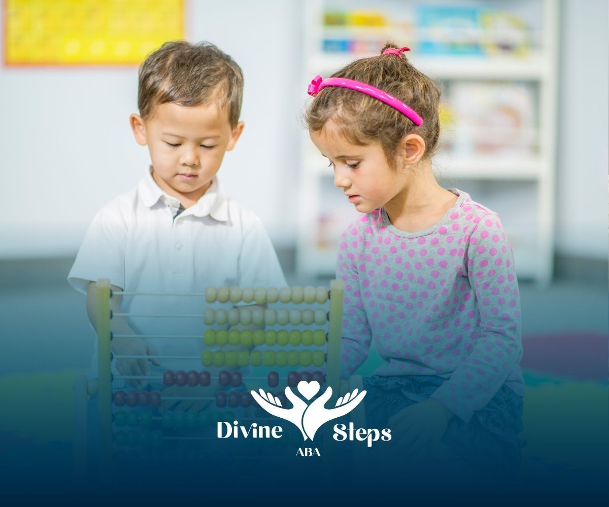 A boy and a girl are playing with blocks in a classroom.
