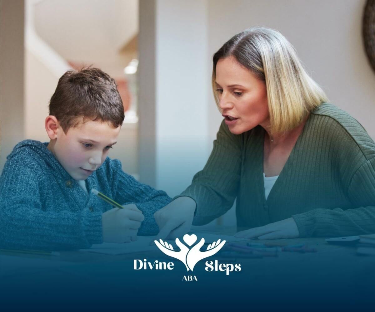 Female therapist guiding a boy with autism through writing exercises at a table with school supplies