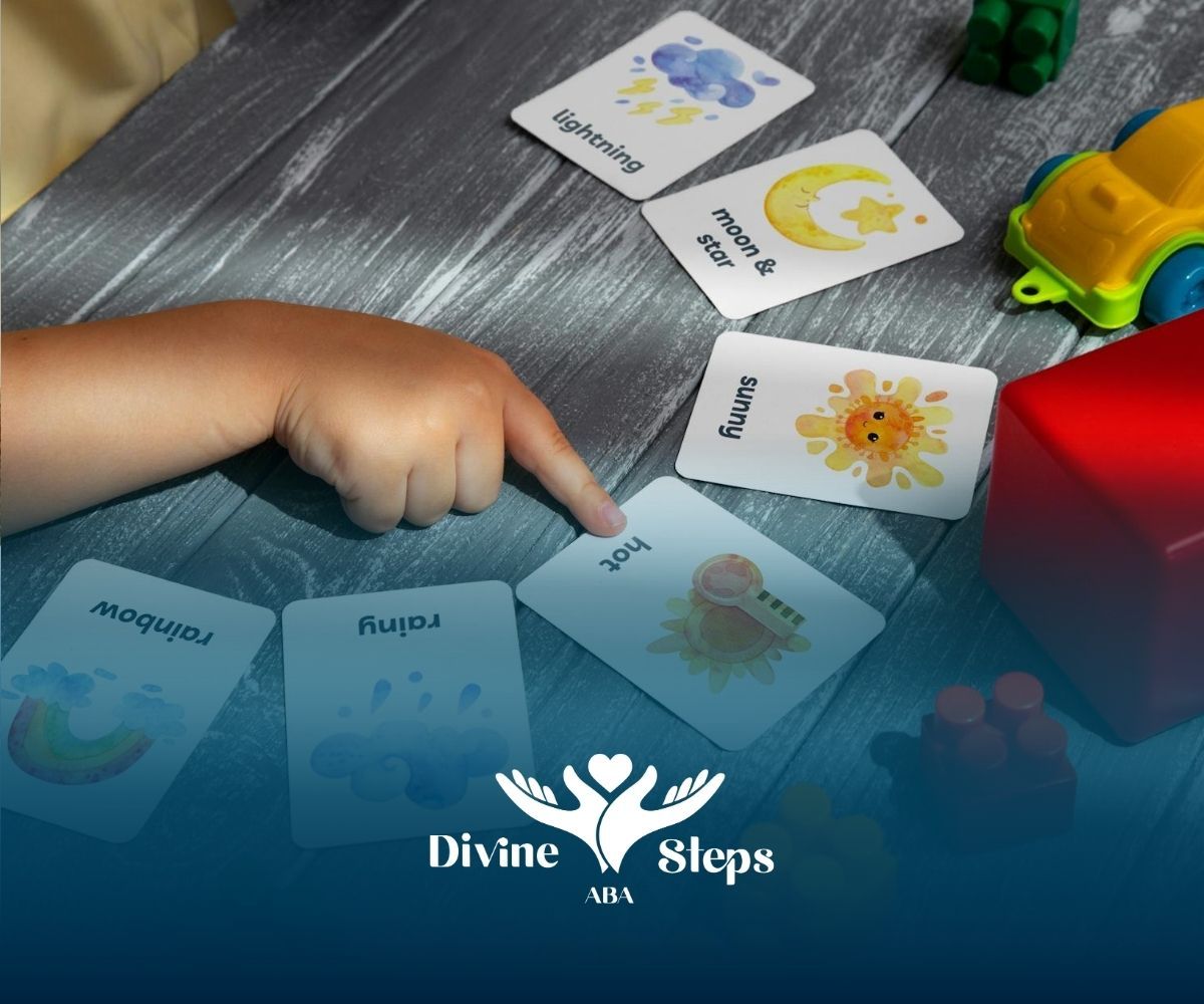 An autistic child pointing at flashcards with toys on a table during an ABA therapy session in NC.