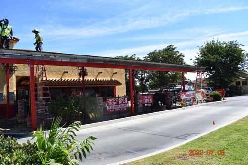 building with solar panel covered sidewalk