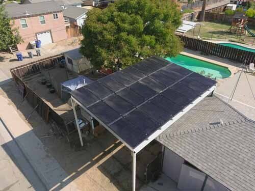 building with pool and solar panels