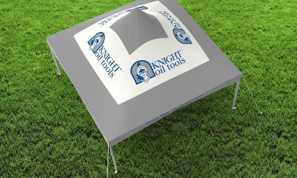 Gray knight tool tent set up on green grass