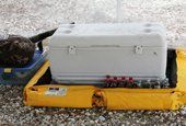 White cooler on a yellow containment berm