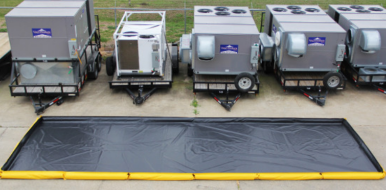 Trailers lined up with a containment berm