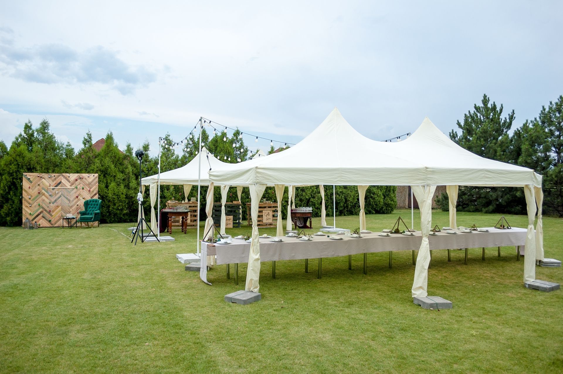 White tent set up outdoors for a gathering