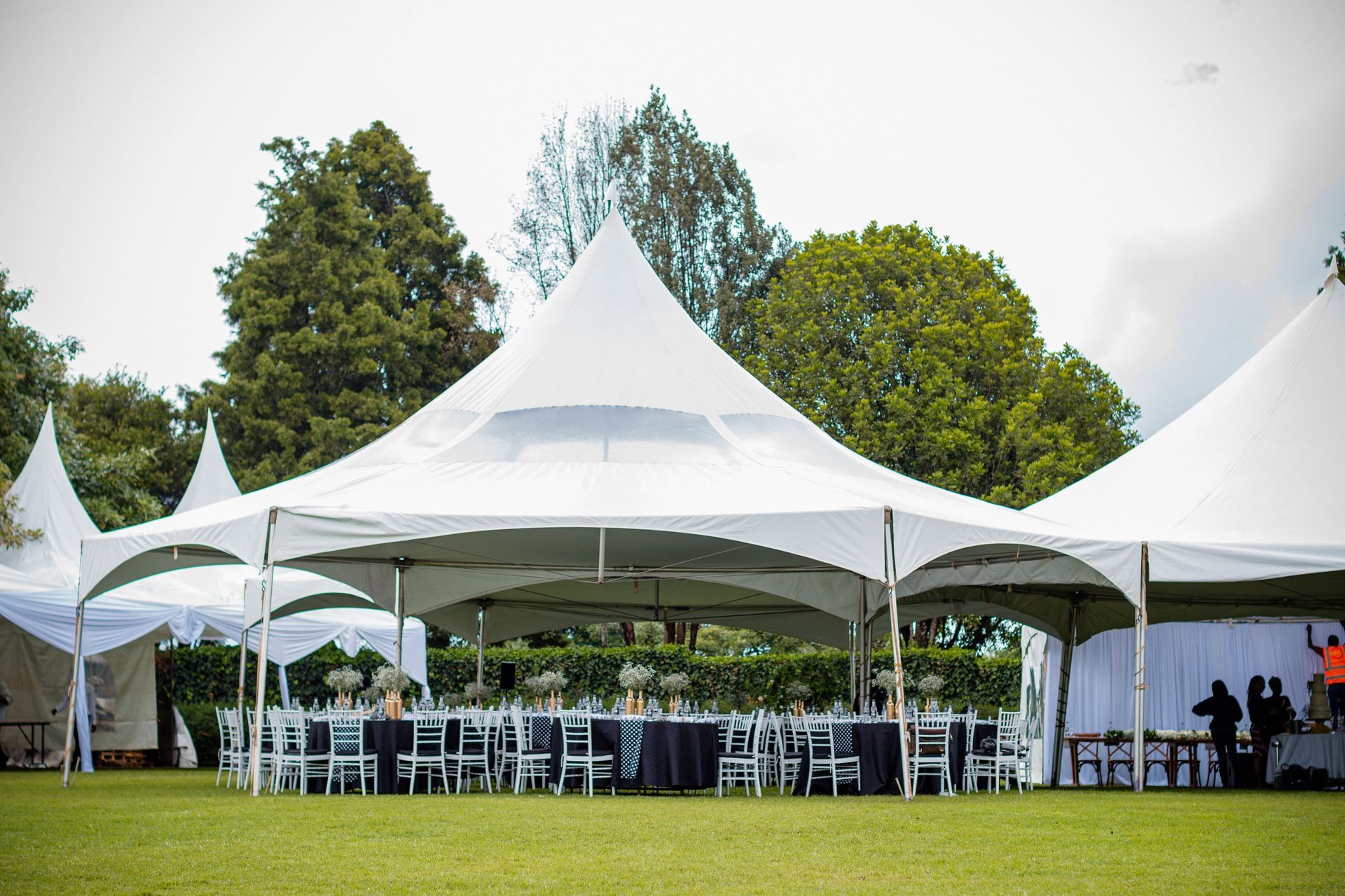 White tent set up on a grassy lawn