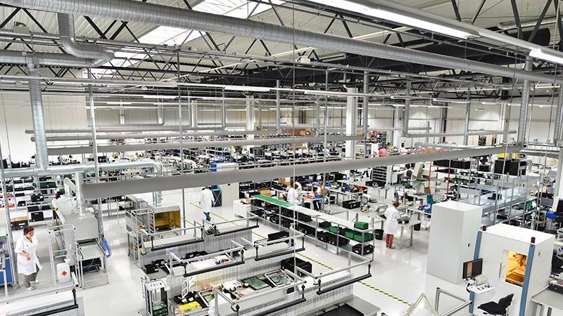 A living room filled with furniture and a ceiling fan.