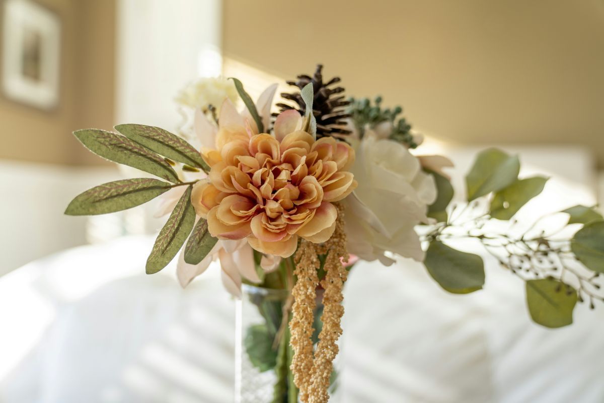 A vase filled with flowers is sitting on a table.