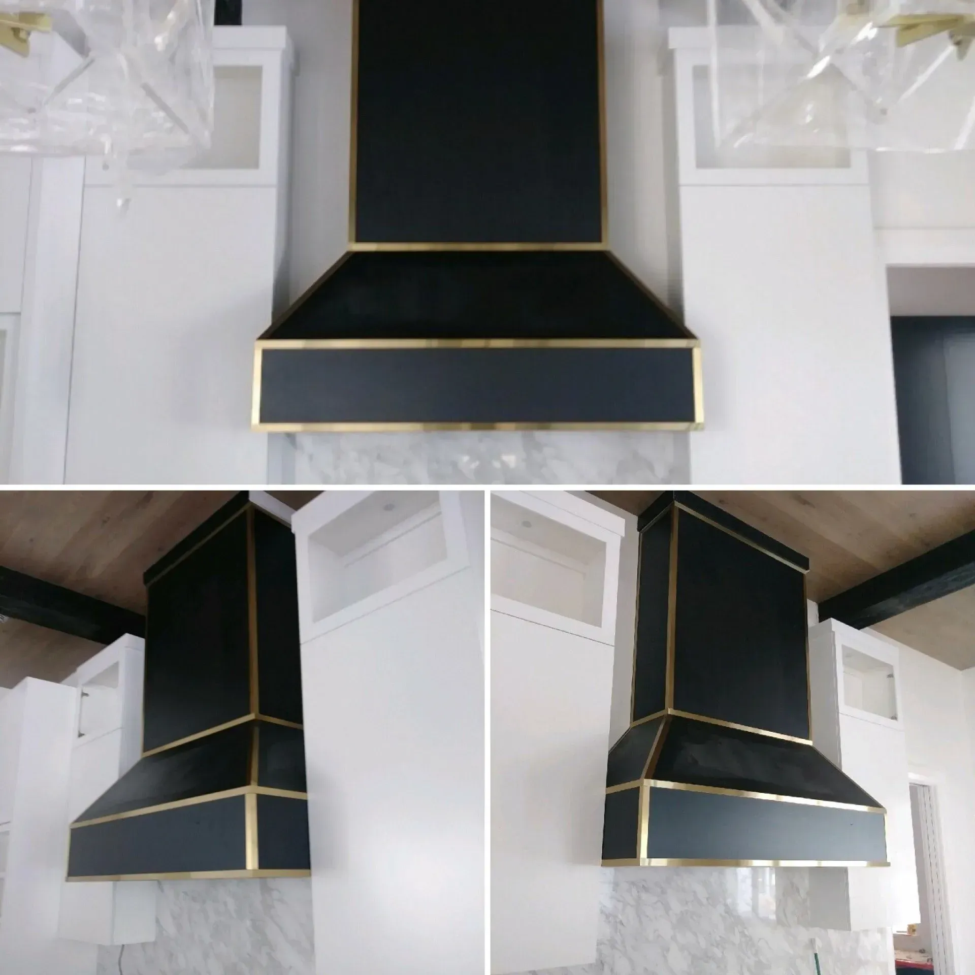 A black hood with gold trim hangs from the ceiling in a kitchen
