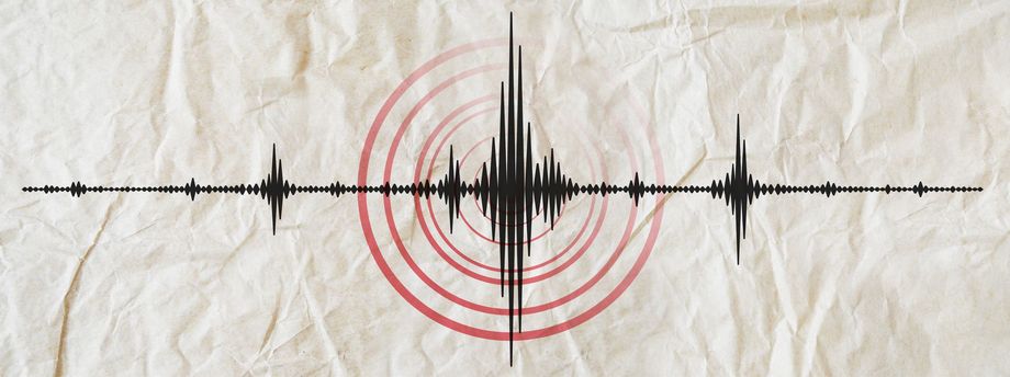 A drawing of an earthquake on a piece of crumpled paper.
