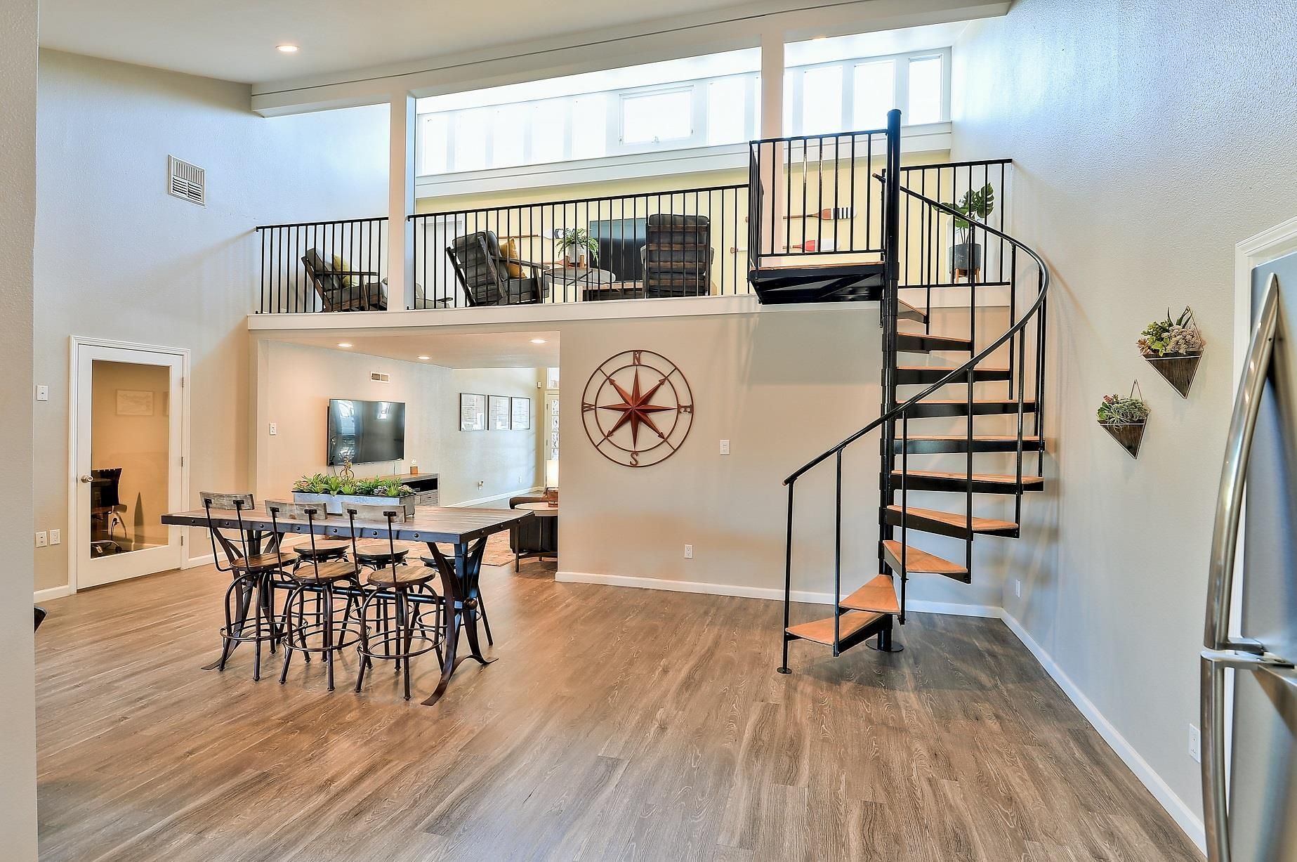 There is a spiral staircase in the middle of the room The Park at Idlewild.