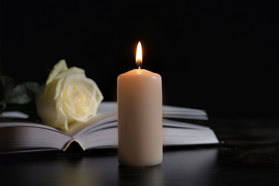Candle, White Rose And Book — Funerals in Cairns, QLD