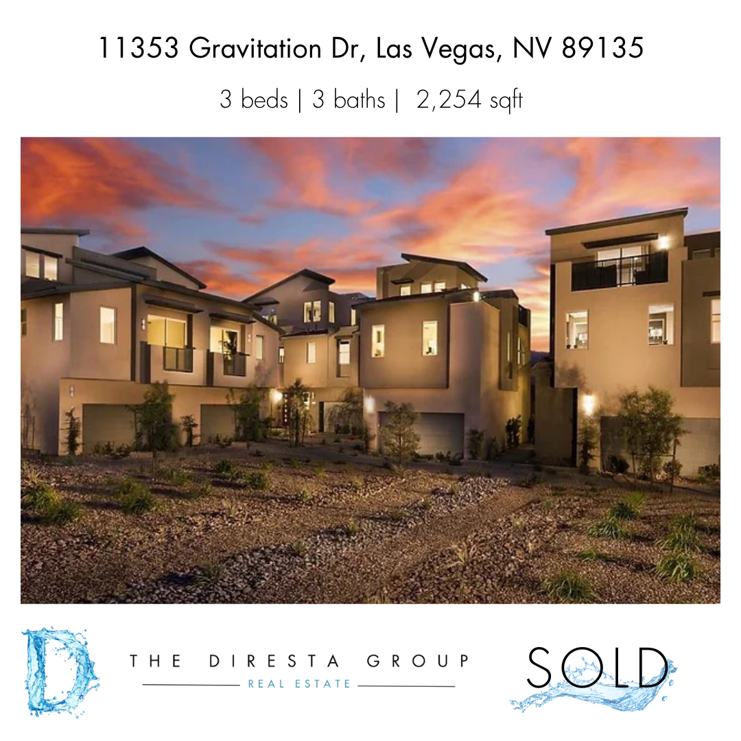 Bright white kitchen with island, seating, dining area, white cabinetry, and stainless steel appliances.