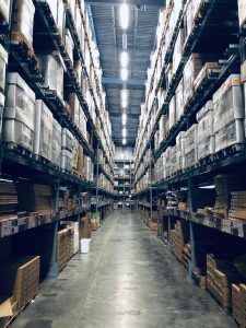 A warehouse filled with lots of boxes and shelves. LED lighting