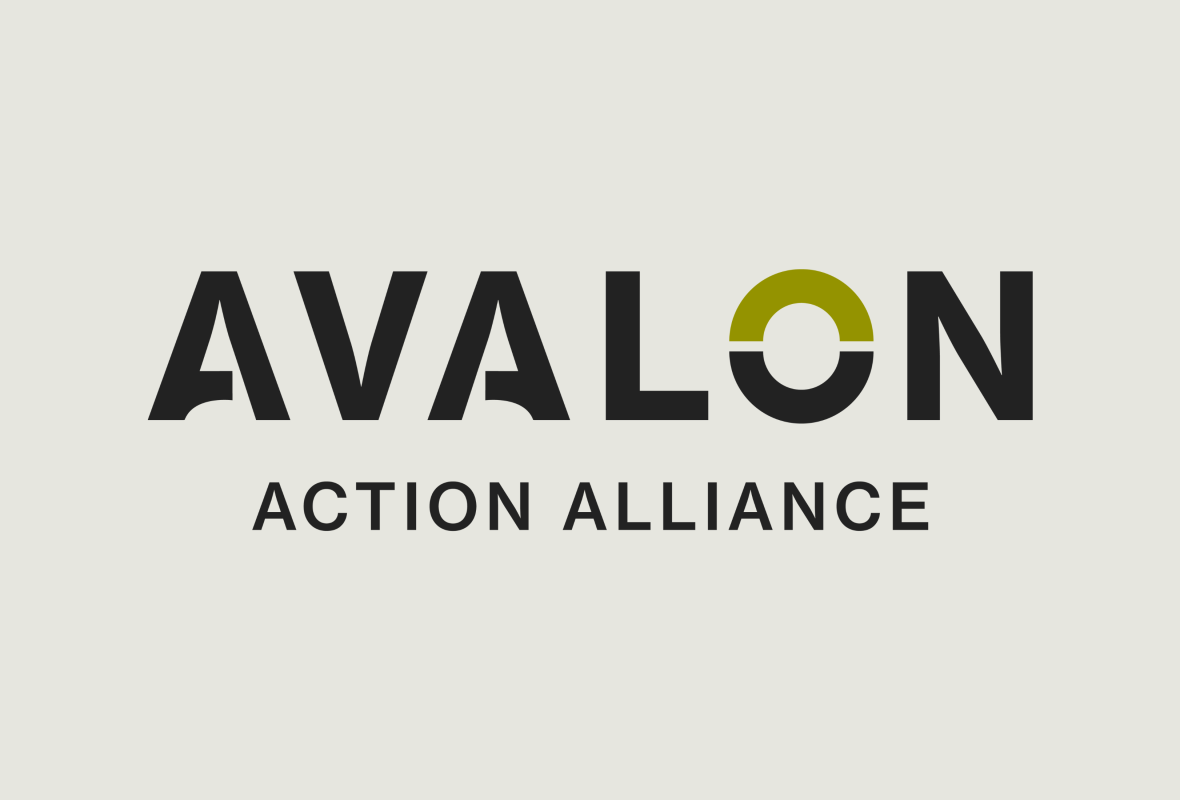 Soldier in camouflage with a German Shepherd dog overlooking a body of water. Sunny day.