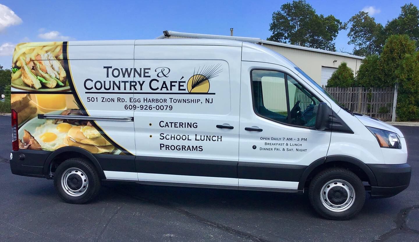 Pepsi sign with the brand's logo: red and blue globe, white background, blue base, outdoors.