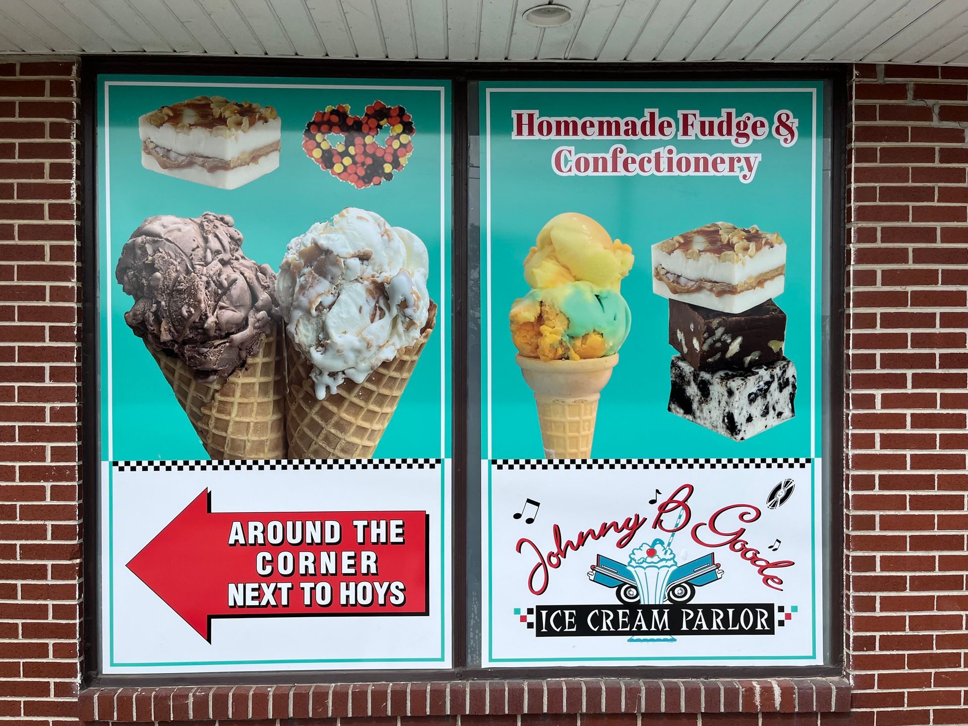 Sign for Johnny B's Ice Cream Parlor, showing ice cream cones, fudge, and directions.