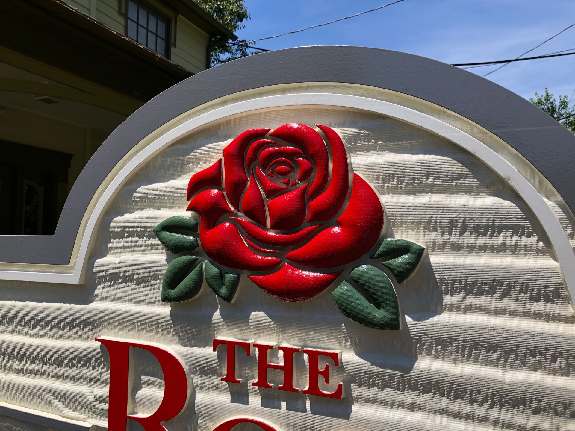 Sign with red rose and 