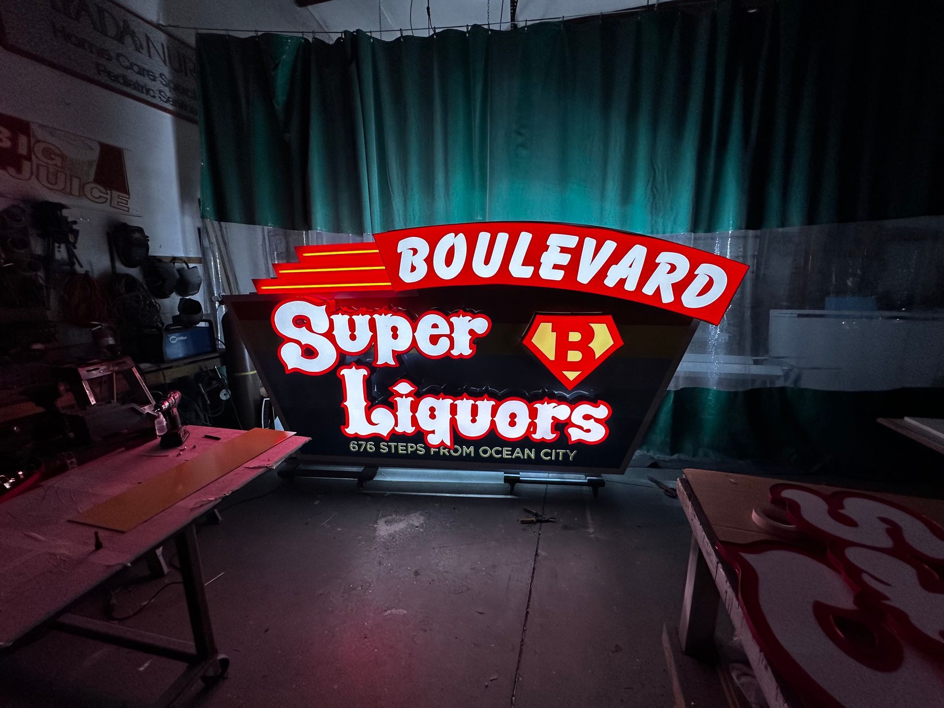 Pepsi sign with the brand's logo: red and blue globe, white background, blue base, outdoors.