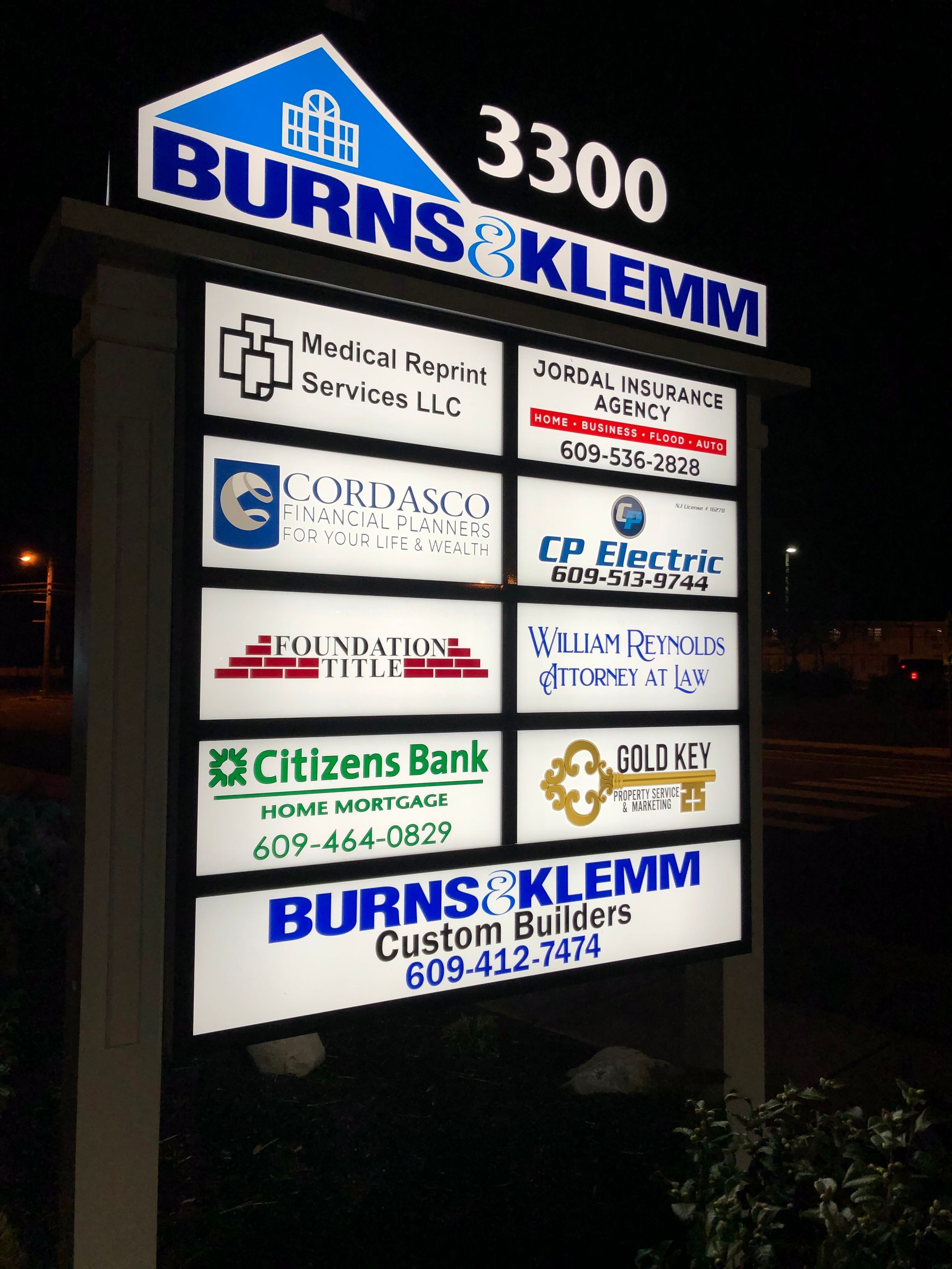 Sign with multiple business names: Burns & Klemm, Medical Repair Services, Ordassco, Foundation Title, Citizens Bank, etc.