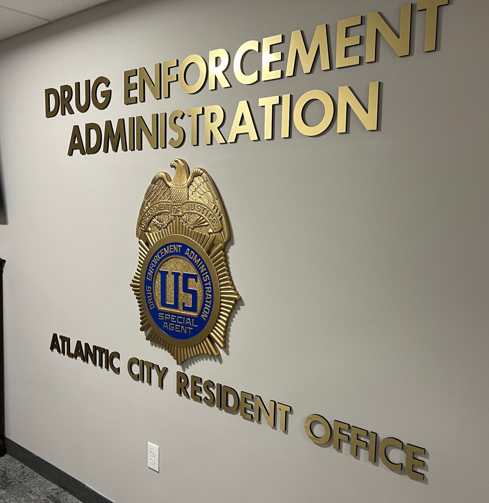 Wall with and DEA emblem, 