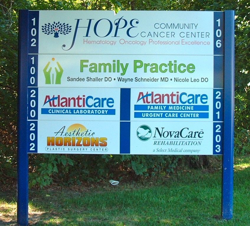 Sign for HOPE Community Cancer Center, Family Practice, Atlanticare, Aesthetic Horizons, and NovaCare.
