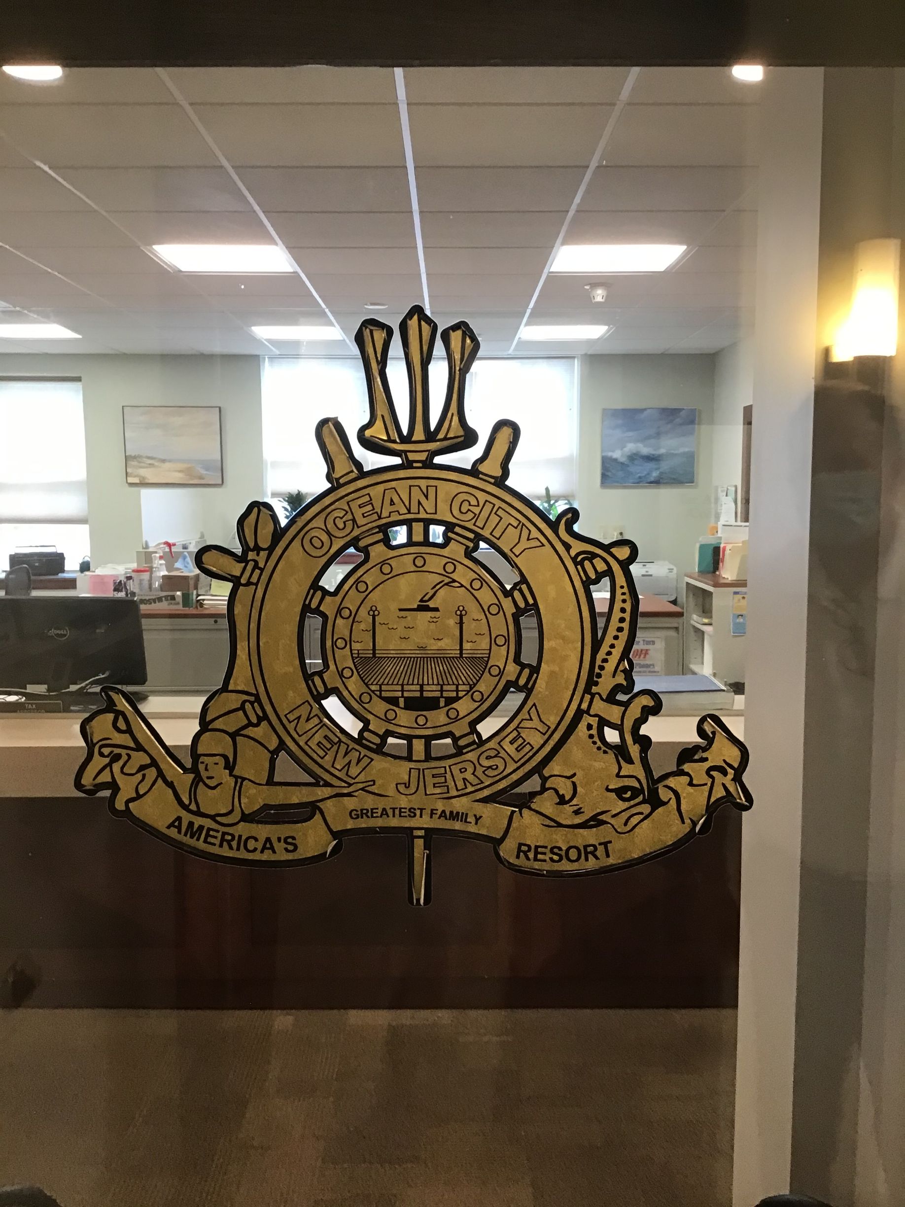 Golden emblem on glass door: 