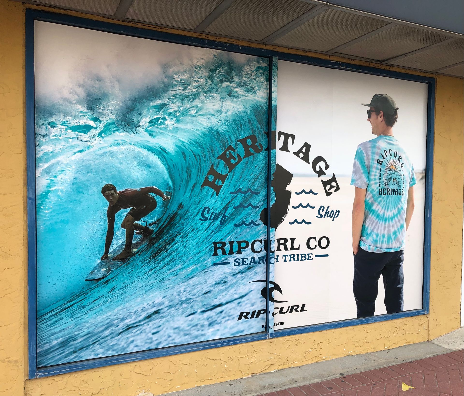 Storefront window with surfing scene 