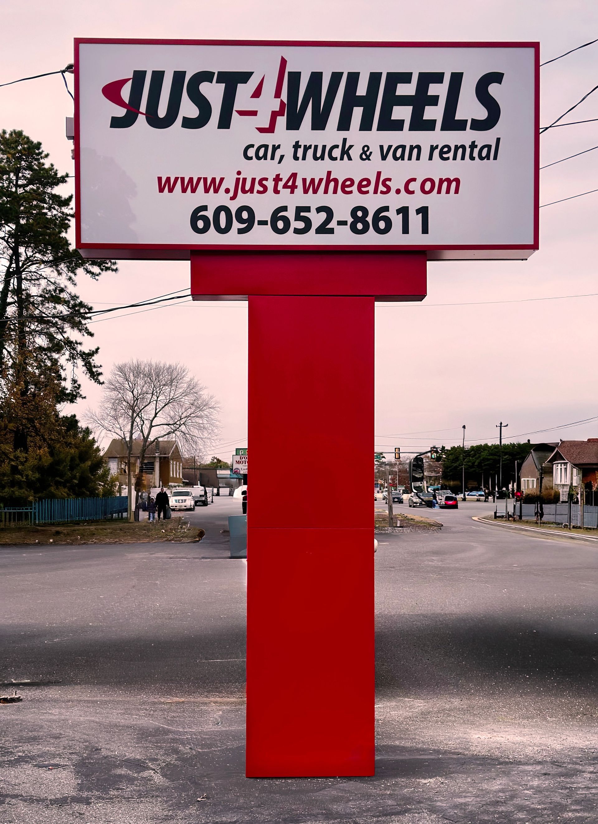 Sign at 1830, listing building A's businesses: Invictus, Laboratory Supply Dist., Custom Cable, and Mek Companies.