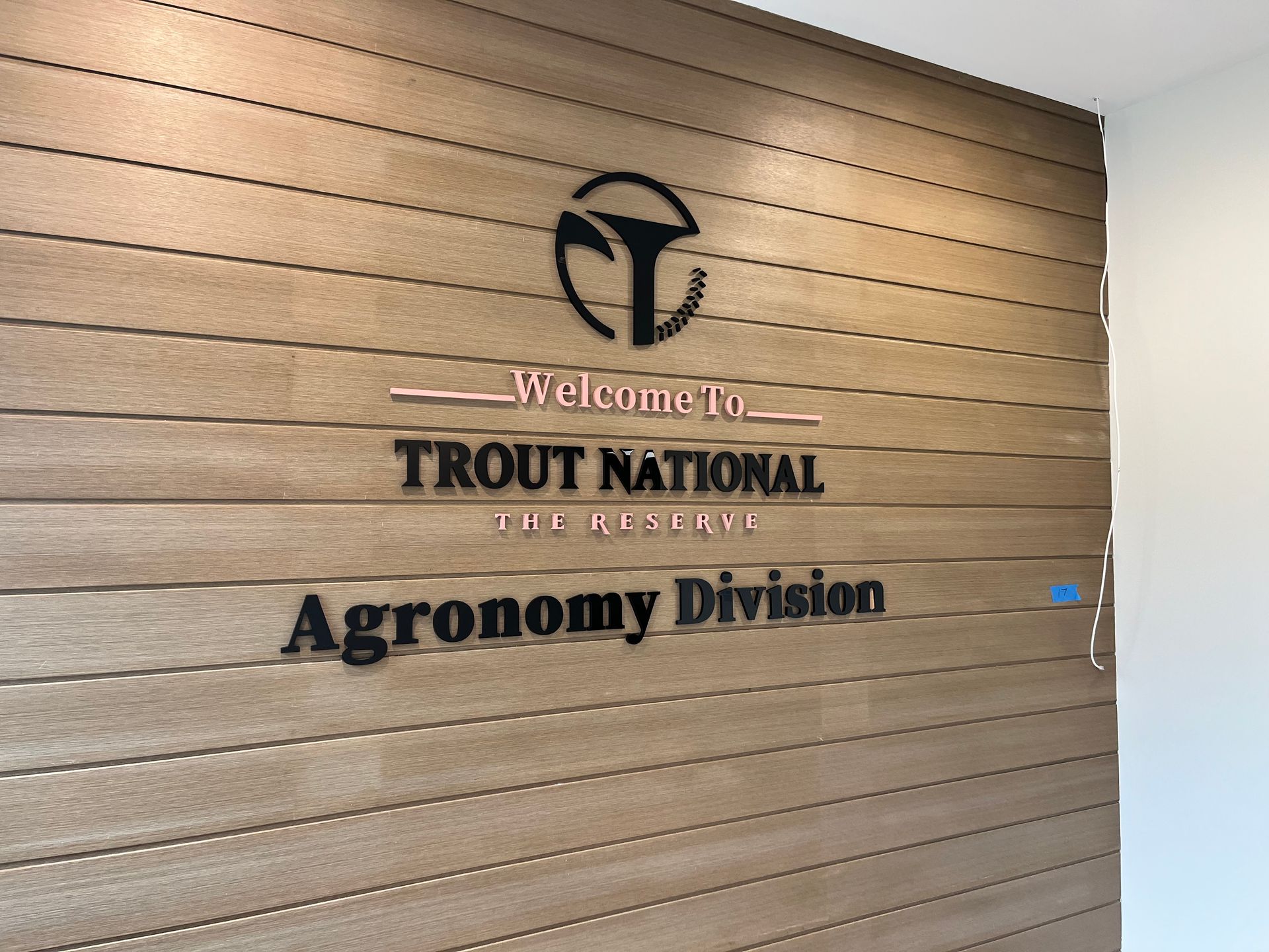 Sign on a wooden wall: 