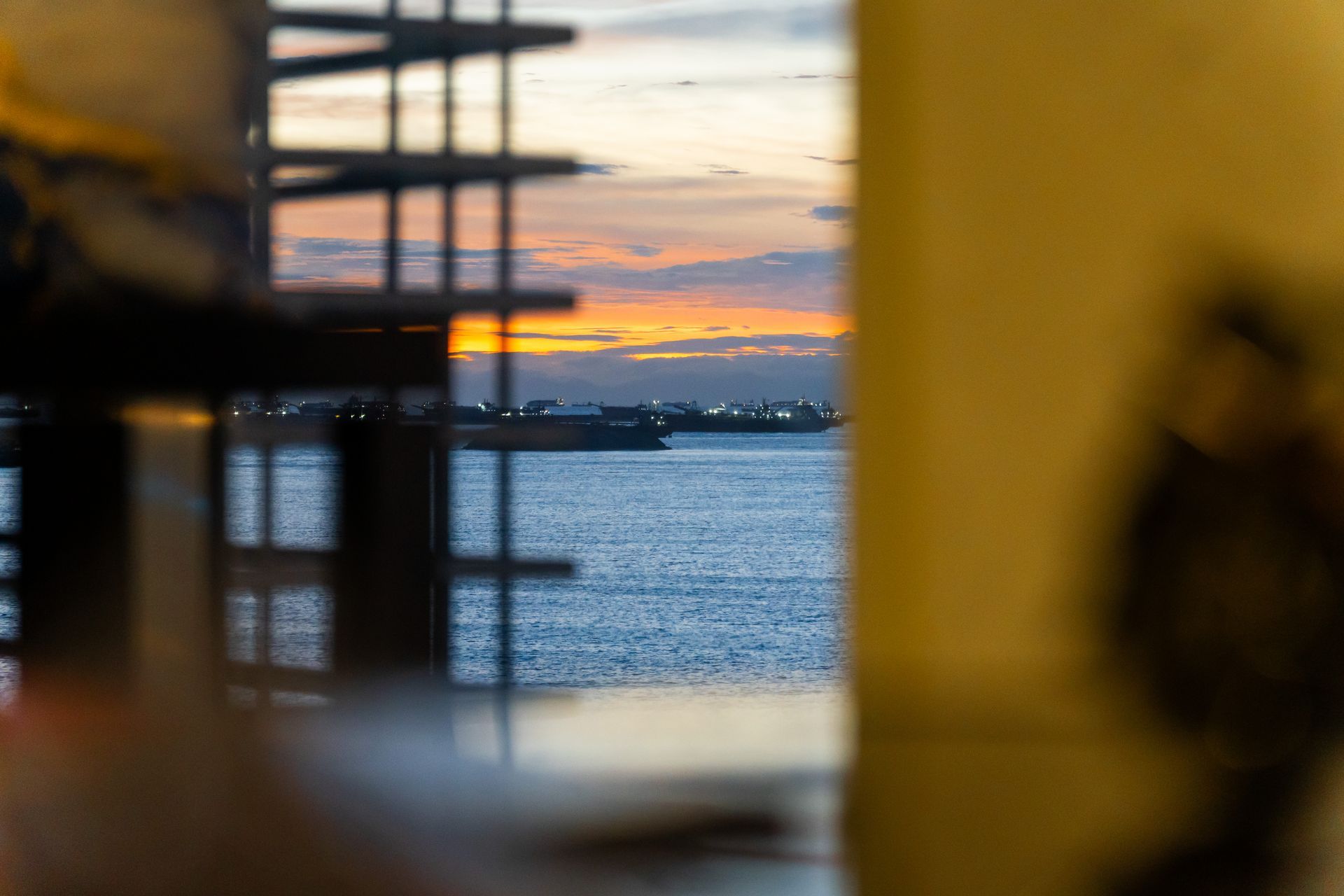 A blurry picture of a sunset over a body of water.