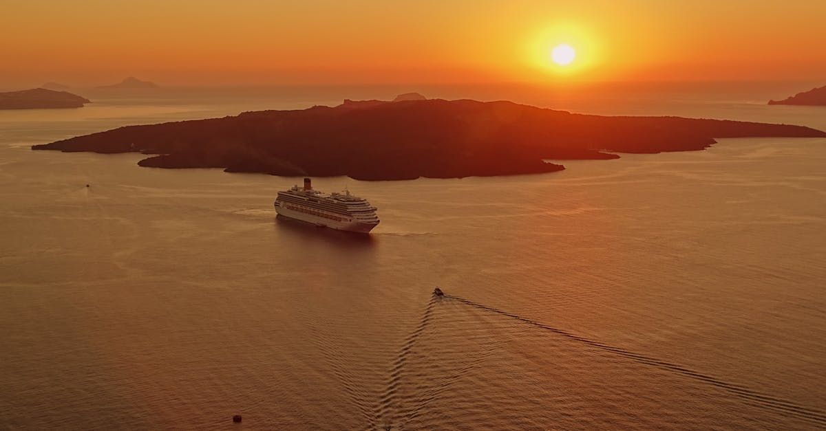 An aerial view of a cruise ship in the ocean at sunset.  Similar views to be found at Bayshore Luxe by Prime, Manila