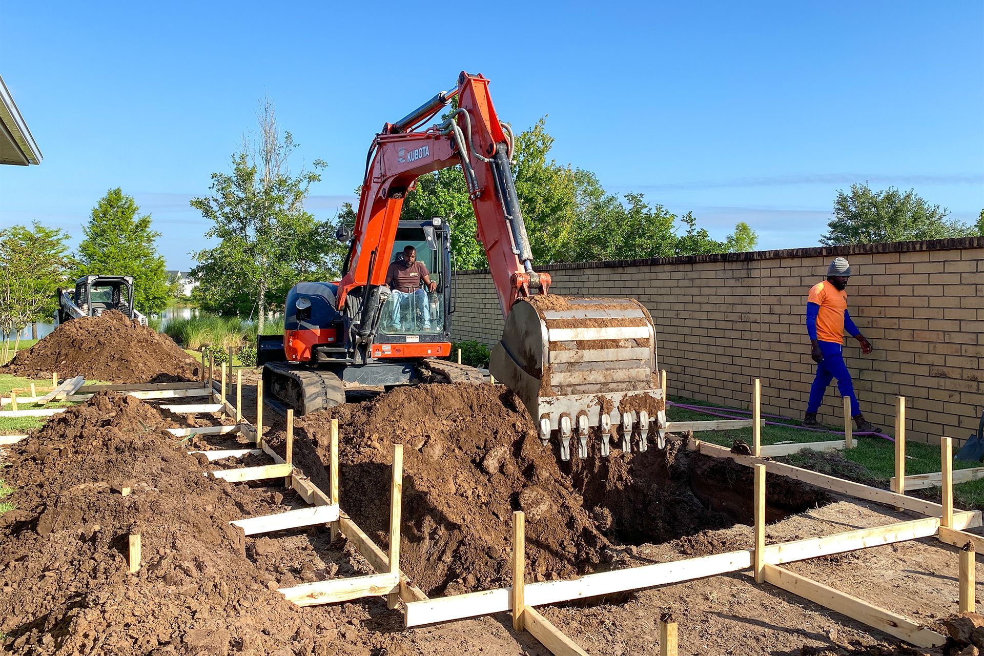 backhoe digging at residential area