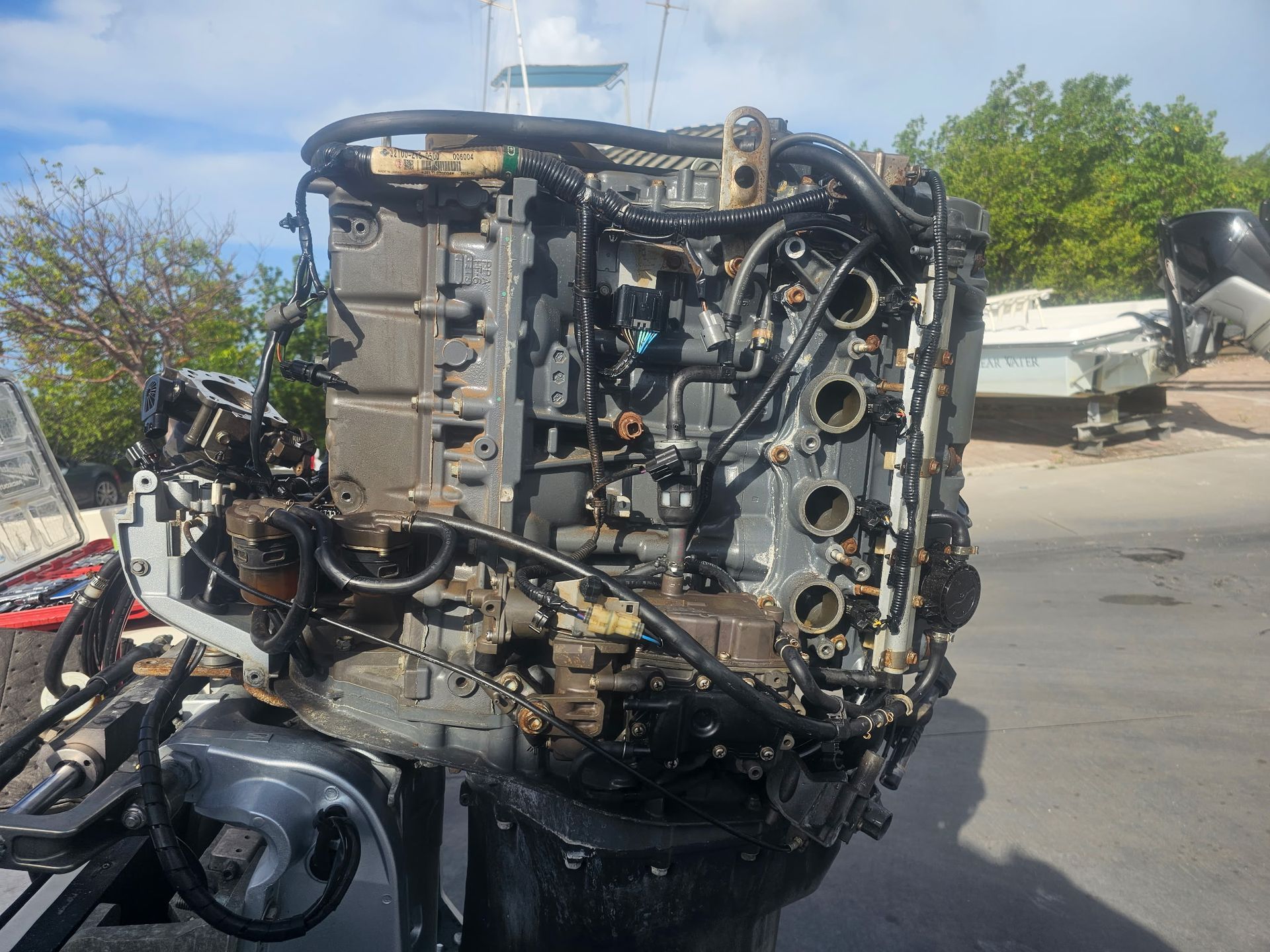 A large engine is sitting on the side of the road.