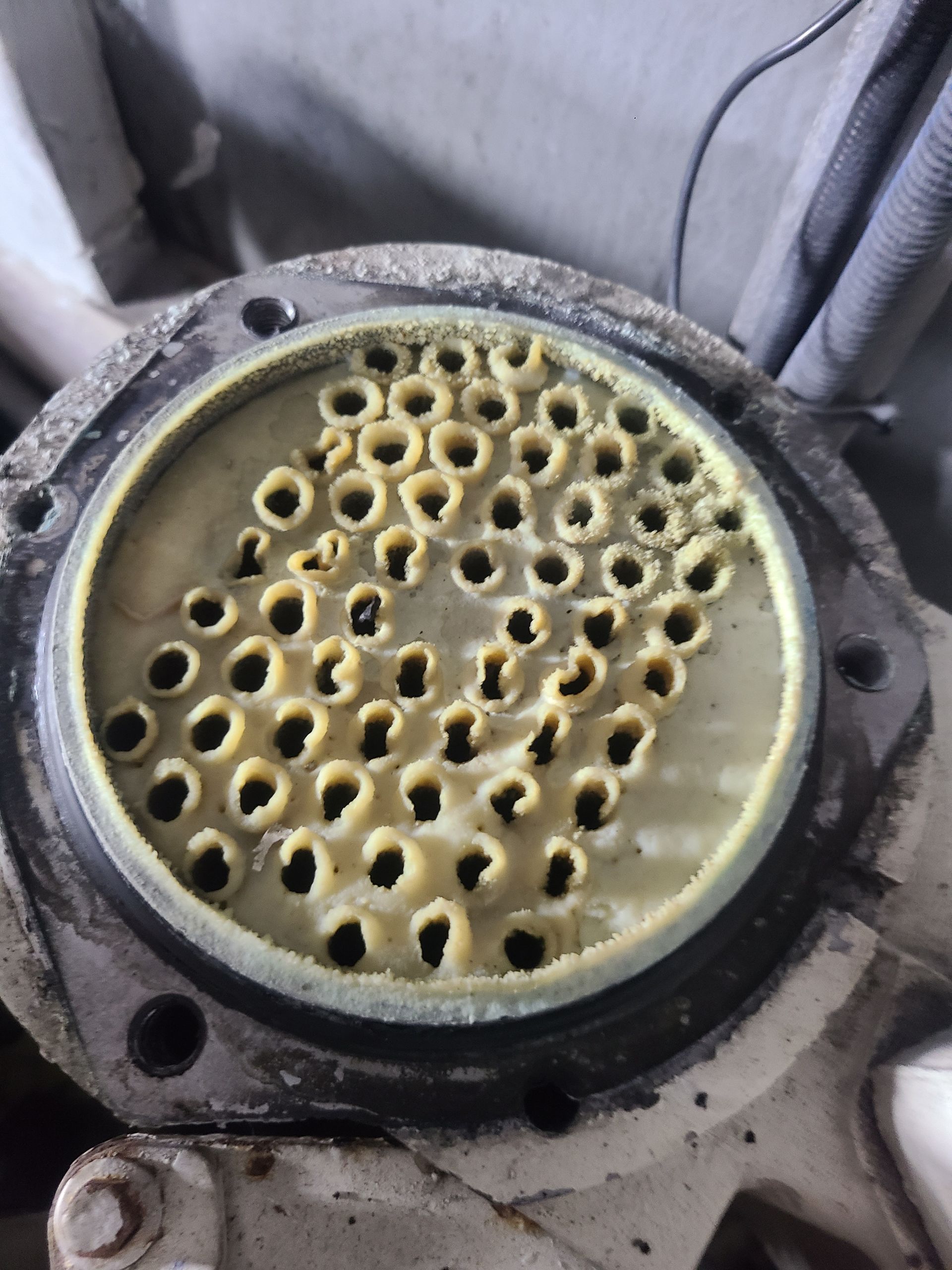 A close up of a circular object with holes in it