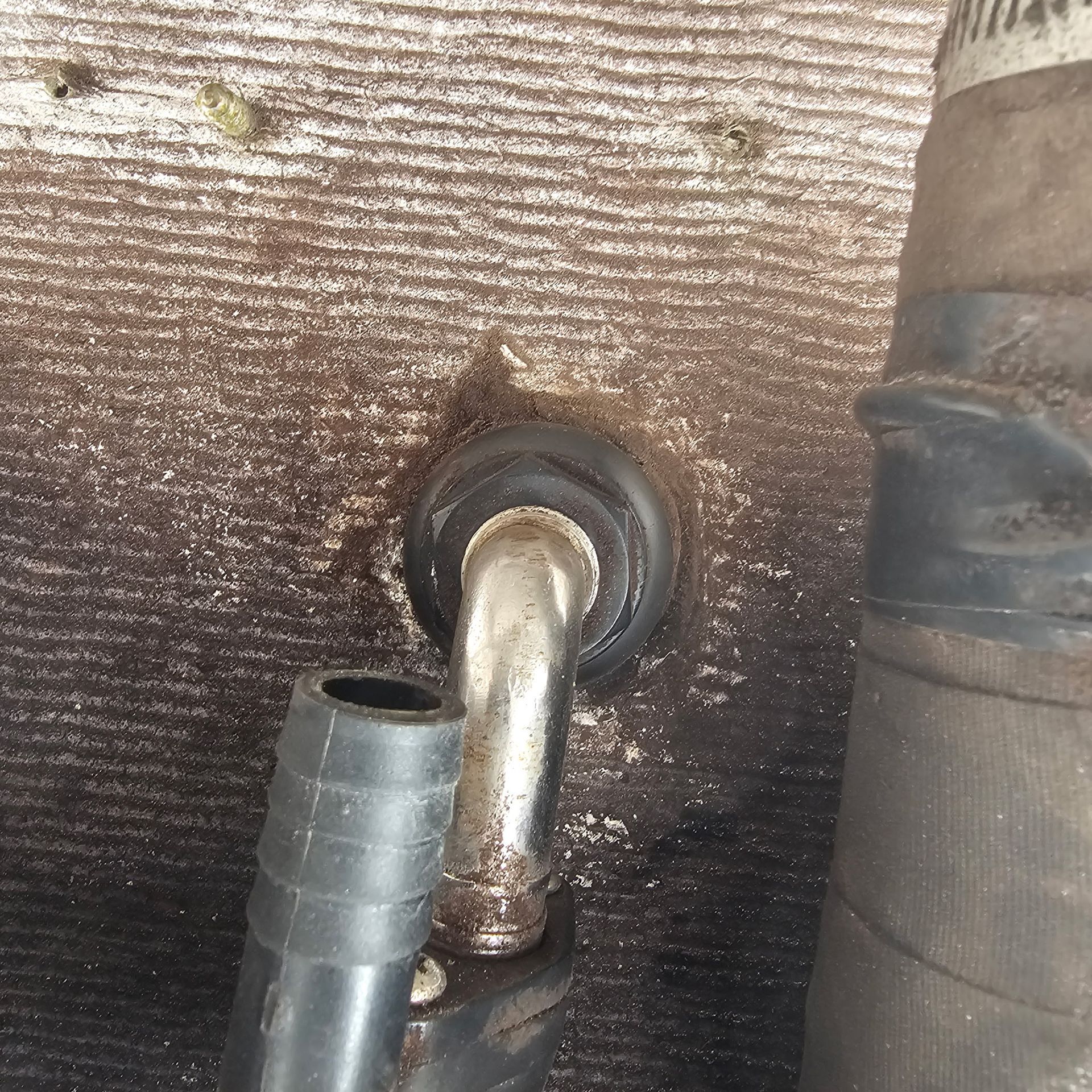 A close up of a hose with a hole in it