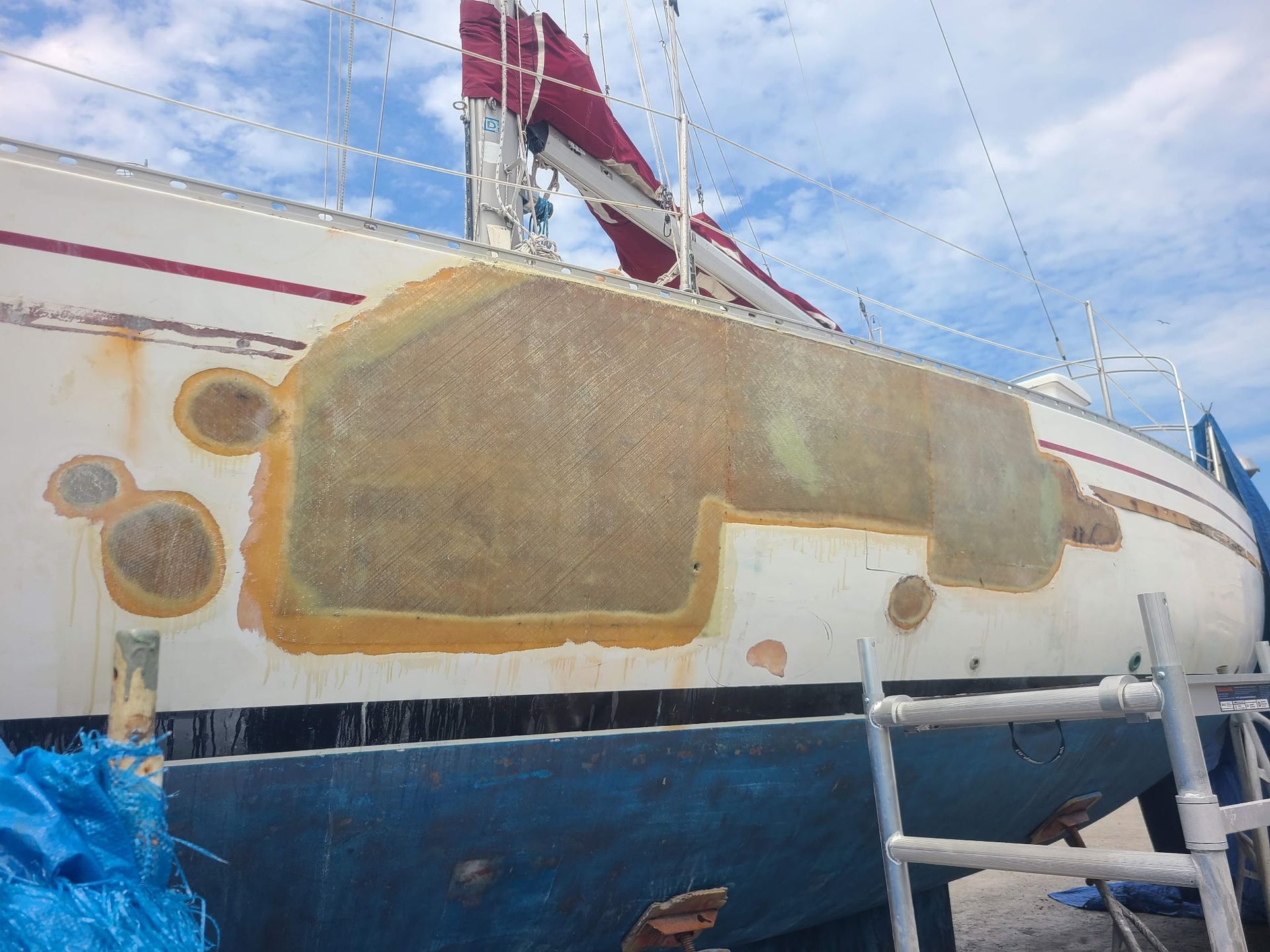 A boat with a ladder on the side of it