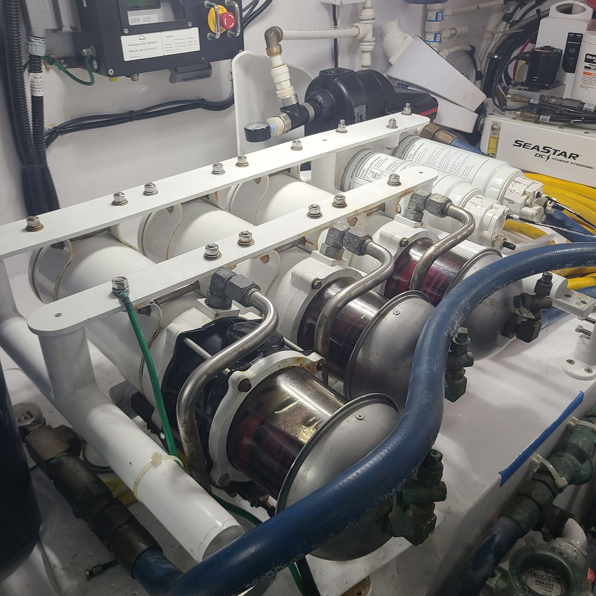 A large engine is sitting on top of a boat.