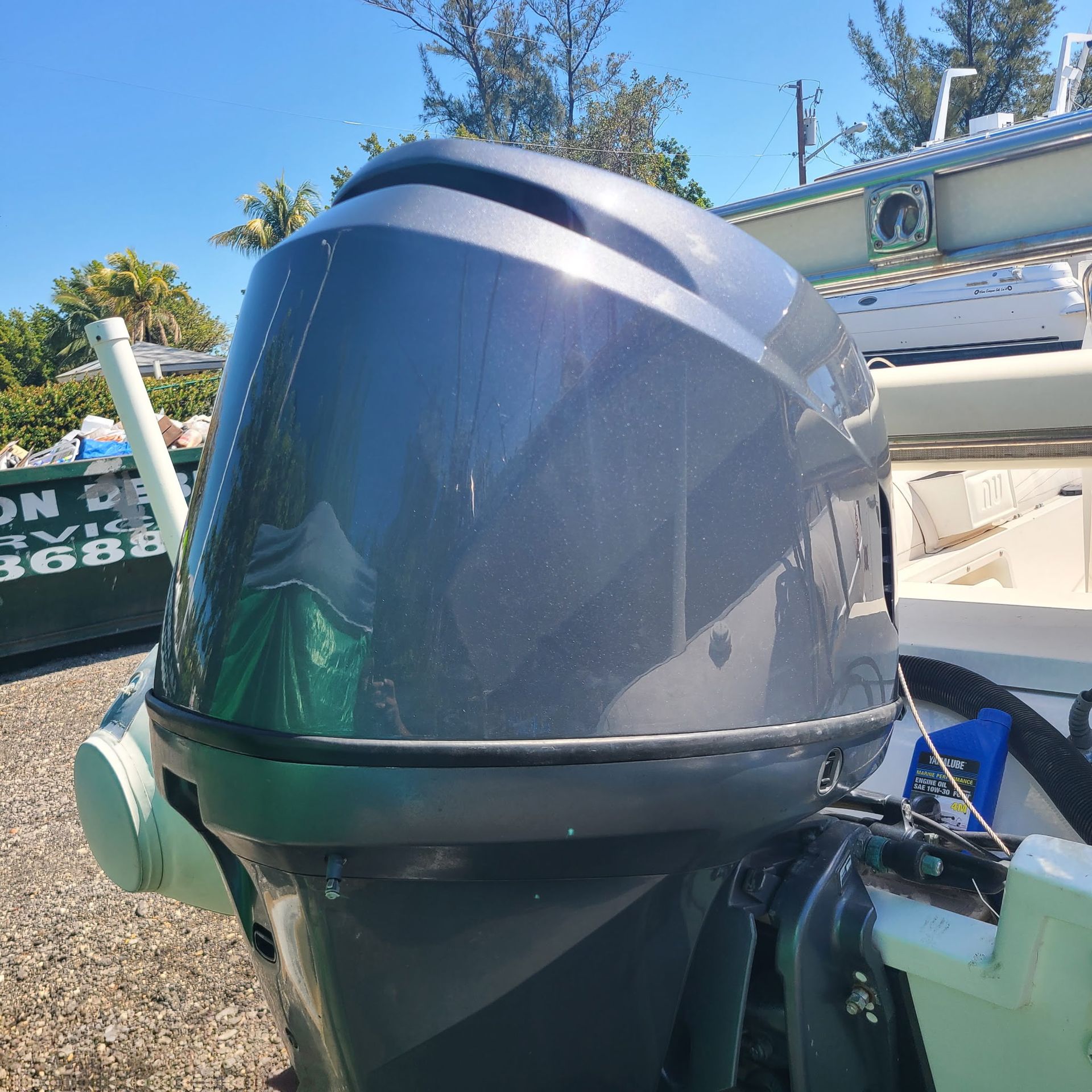 A yamaha outboard motor is parked on the side of a boat.