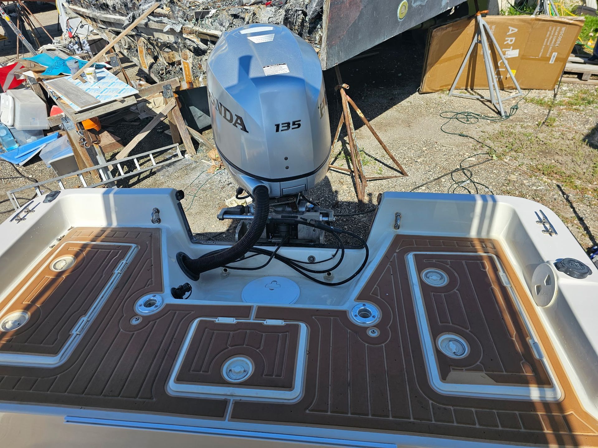 A boat with a honda outboard motor on the back of it