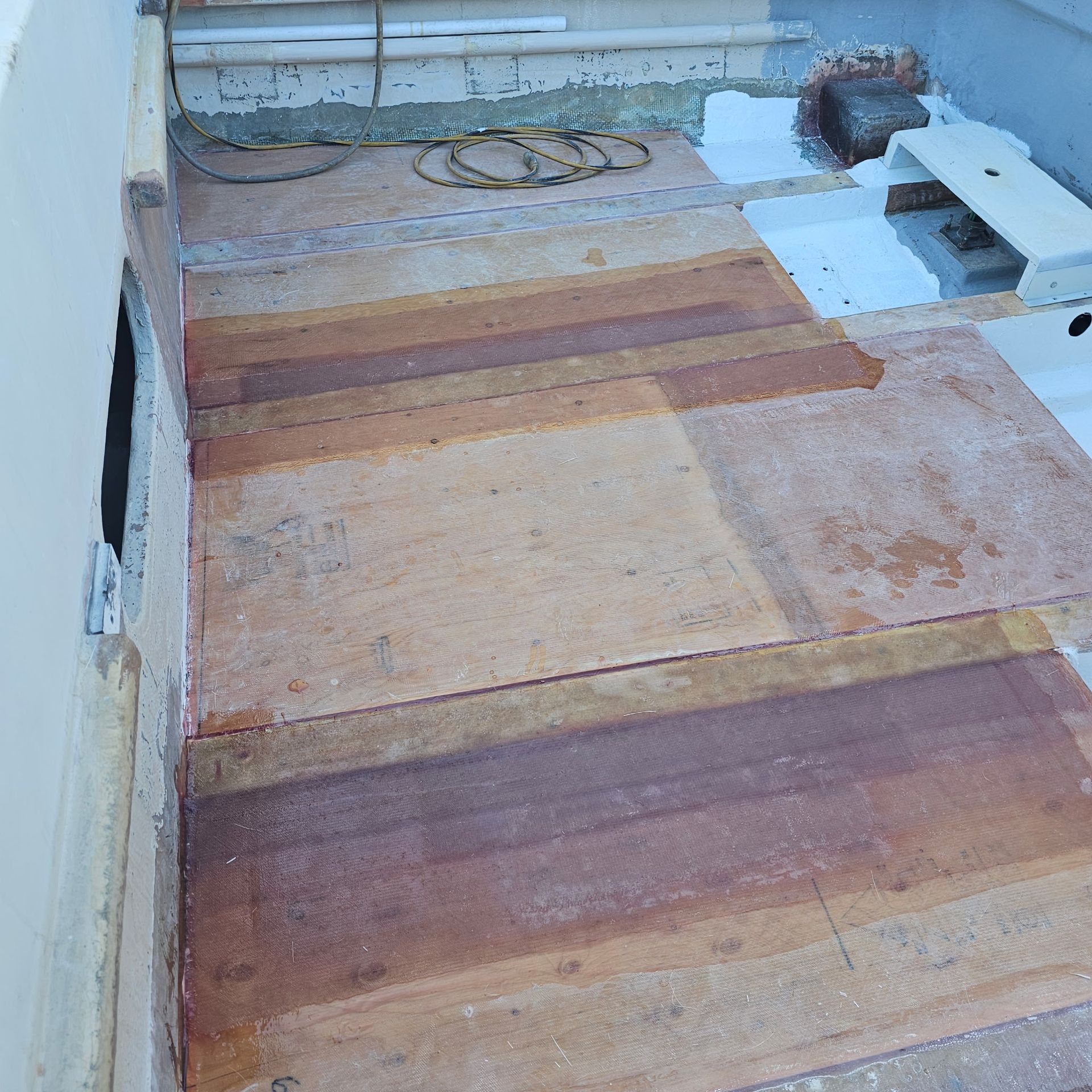 A wooden floor with a few pieces of wood on it