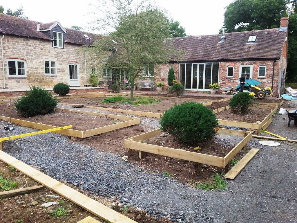A large brick house is being built in the countryside.