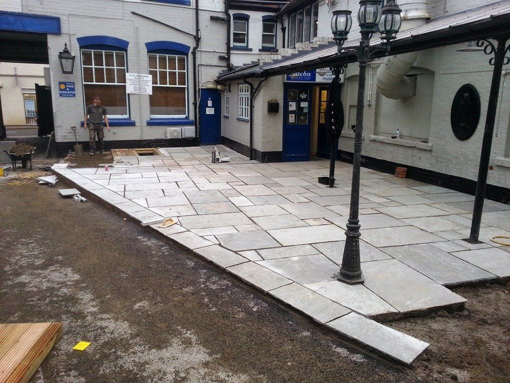A patio is being built in front of a building