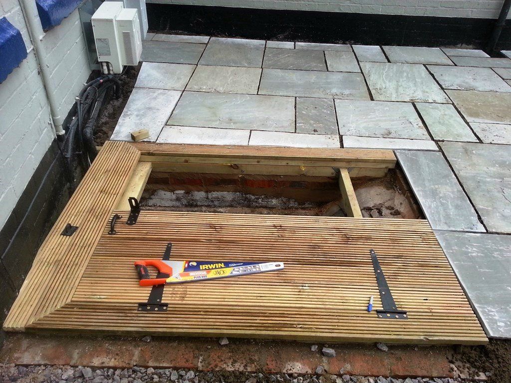 A wooden deck with a saw on top of it